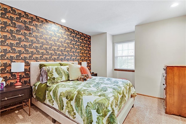 bedroom with wallpapered walls, an accent wall, baseboards, recessed lighting, and a textured ceiling