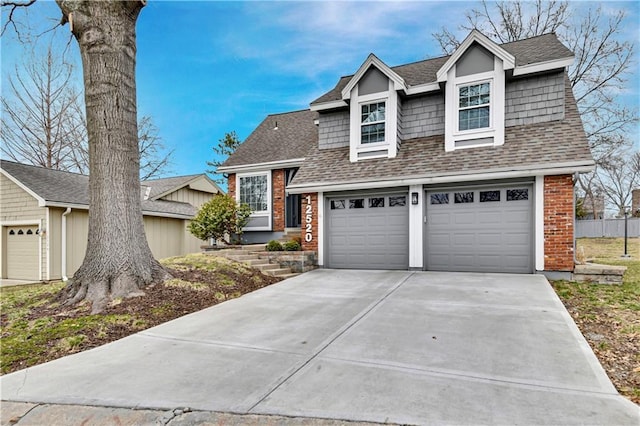 view of front of house featuring brick siding, concrete driveway, a shingled roof, and an attached garage