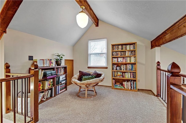 sitting room with vaulted ceiling with beams, baseboards, carpet floors, an upstairs landing, and a textured ceiling