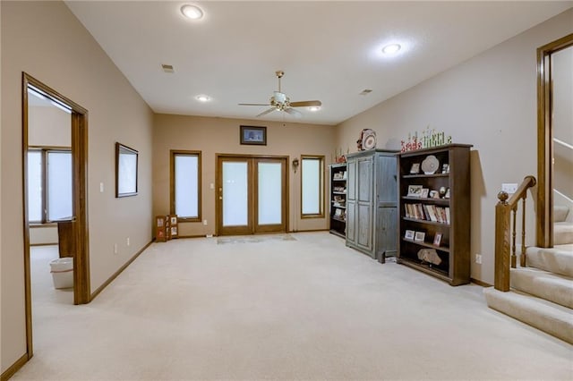 interior space featuring recessed lighting, carpet flooring, baseboards, stairs, and french doors