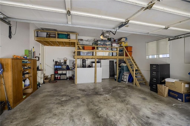 garage with fridge and a garage door opener