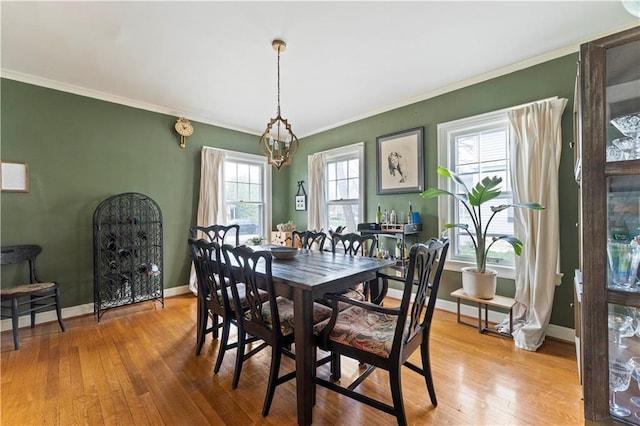 319 S Elm St, Ottawa, KS 66067 - dining room featuring hardwood / wood-style floors and ornamental molding