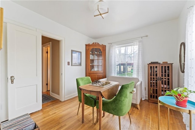 319 S Elm St, Ottawa, KS 66067 - dining space with light wood-style floors