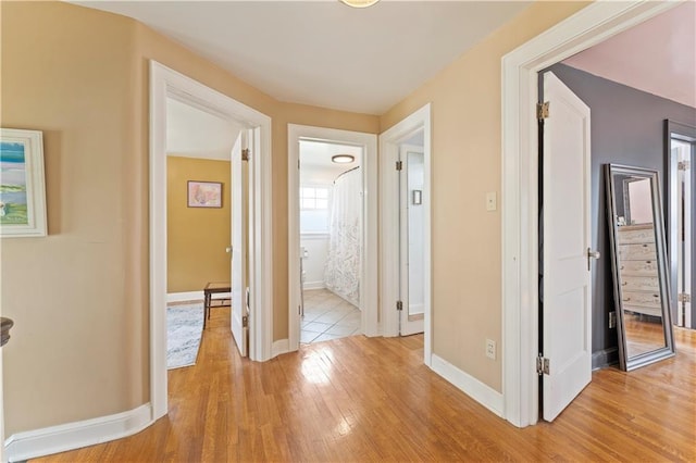 319 S Elm St, Ottawa, KS 66067 - corridor with light wood-style floors and baseboards
