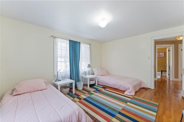 319 S Elm St, Ottawa, KS 66067 - bedroom with wood finished floors