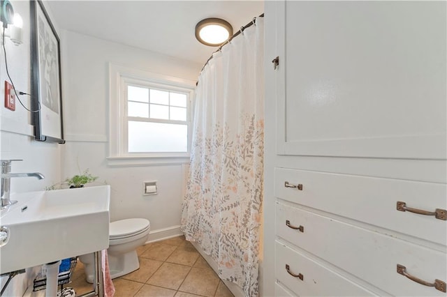 319 S Elm St, Ottawa, KS 66067 - bathroom featuring tile patterned floors and a shower with curtain