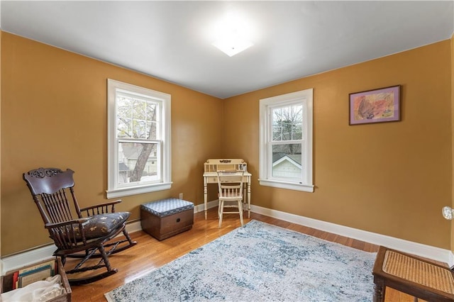 319 S Elm St, Ottawa, KS 66067 - sitting room with wood finished floors