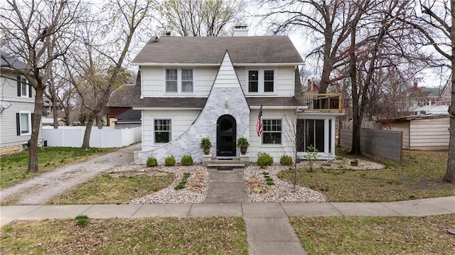 319 S Elm St, Ottawa, KS 66067 - view of front of house featuring a balcony, a chimney, and roof with shingles