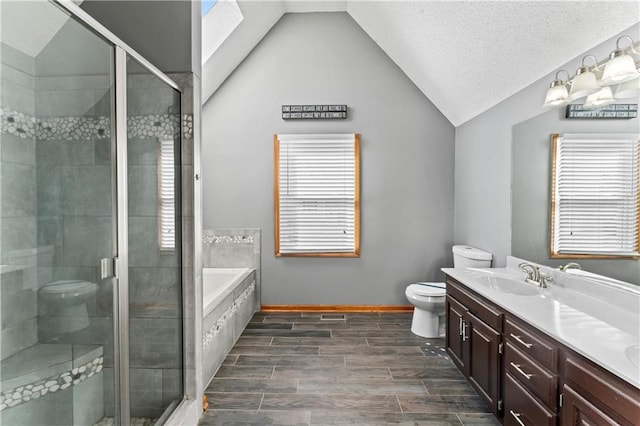 bathroom featuring lofted ceiling, a sink, a bath, double vanity, and a stall shower