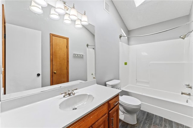 full bathroom featuring visible vents, toilet, tub / shower combination, vanity, and wood finished floors