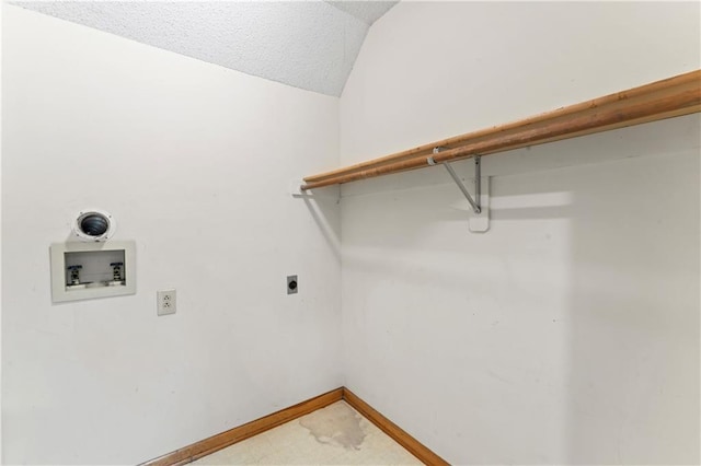 laundry area with laundry area, baseboards, a textured ceiling, washer hookup, and electric dryer hookup