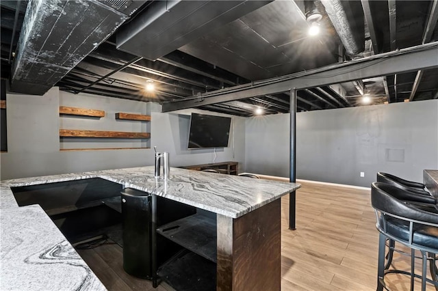 interior space with light wood-style flooring and baseboards