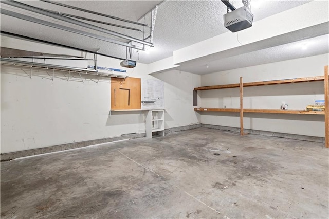 garage featuring baseboards and a garage door opener