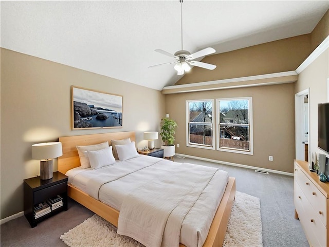 carpeted bedroom featuring vaulted ceiling, visible vents, a ceiling fan, and baseboards