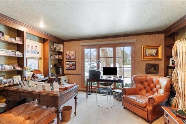 office area with ornamental molding, a textured ceiling, carpet flooring, and built in shelves