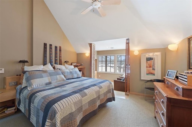 bedroom with light colored carpet, a ceiling fan, baseboards, and vaulted ceiling