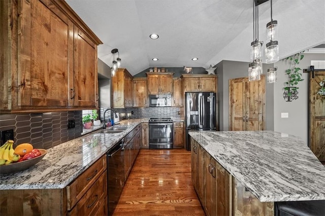 20880 W 224th St, Spring Hill, KS 66083 - kitchen with black appliances, a sink, a center island, lofted ceiling, and dark wood-style floors