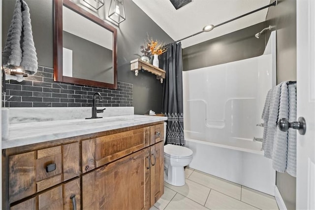 20880 W 224th St, Spring Hill, KS 66083 - bathroom featuring backsplash, toilet, vanity, shower / bath combination with curtain, and tile patterned flooring