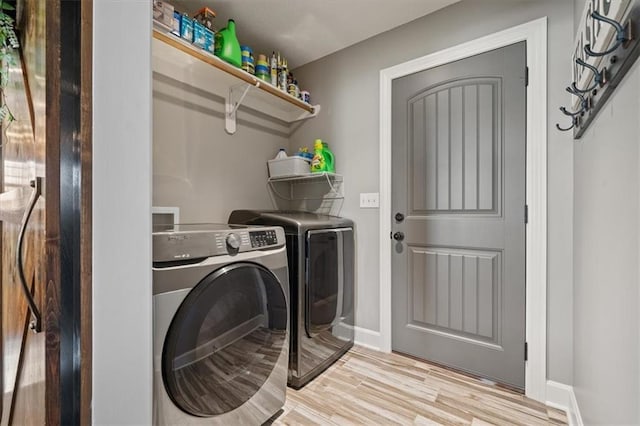 20880 W 224th St, Spring Hill, KS 66083 - washroom featuring washing machine and dryer, light wood-style flooring, and baseboards