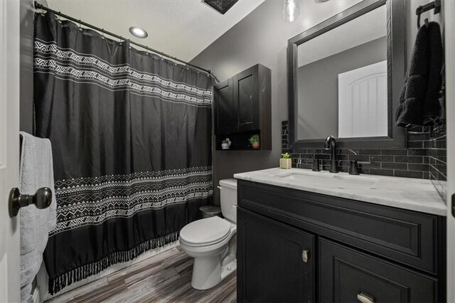 20880 W 224th St, Spring Hill, KS 66083 - full bathroom featuring toilet, vanity, tasteful backsplash, wood finished floors, and a shower with curtain
