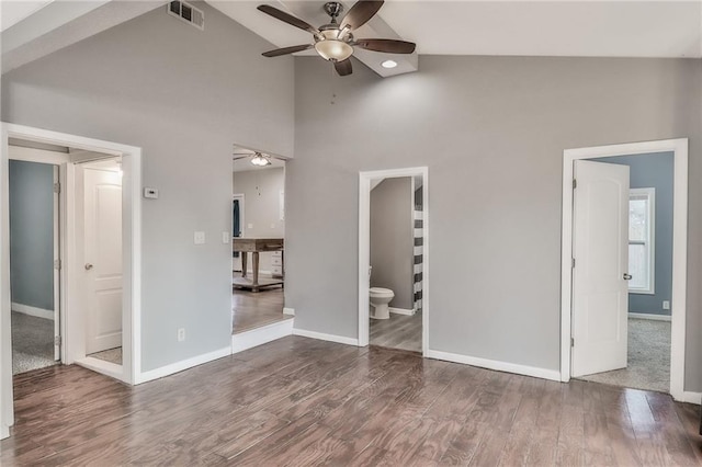 unfurnished bedroom with baseboards, visible vents, and wood finished floors