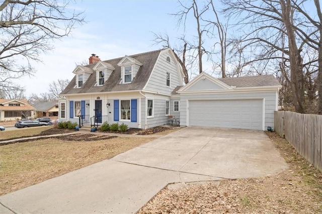 view of front facade featuring a garage, fence, a gambrel roof, driveway, and a chimney