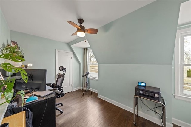 office space with vaulted ceiling, wood finished floors, a ceiling fan, and baseboards