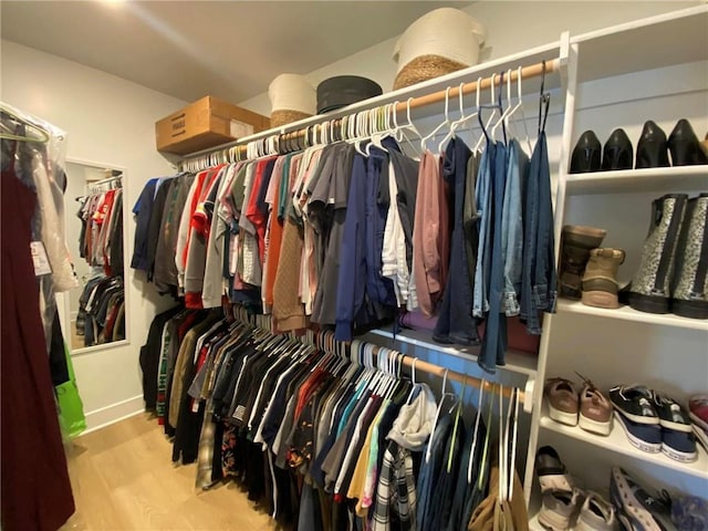 walk in closet featuring light wood-style flooring