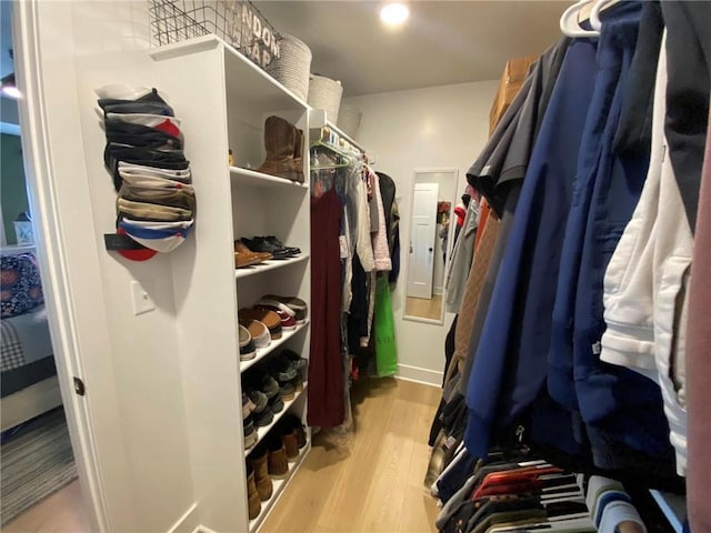 walk in closet featuring light wood finished floors