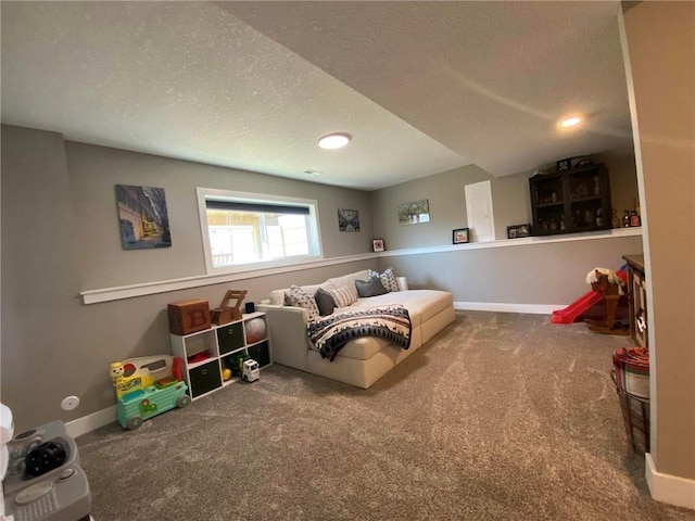 bedroom with carpet floors, a textured ceiling, and baseboards