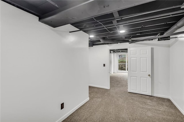 basement with carpet floors and baseboards