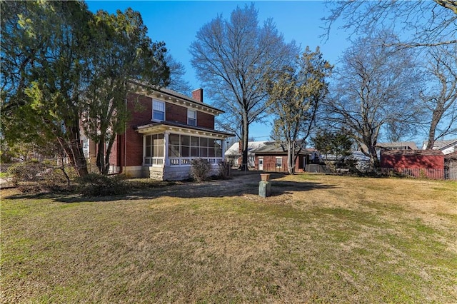 view of yard featuring a sunroom