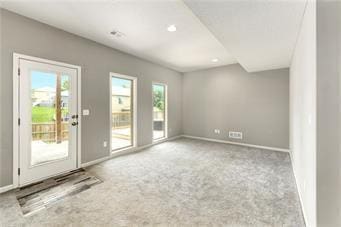 interior space with recessed lighting, a healthy amount of sunlight, and baseboards