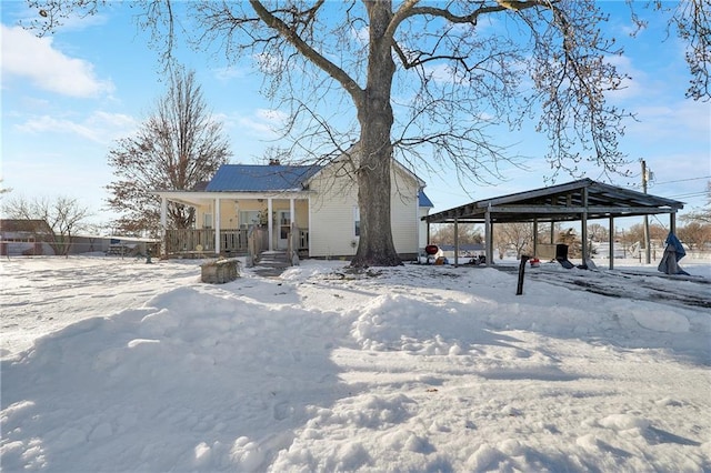 exterior space featuring covered porch and a carport