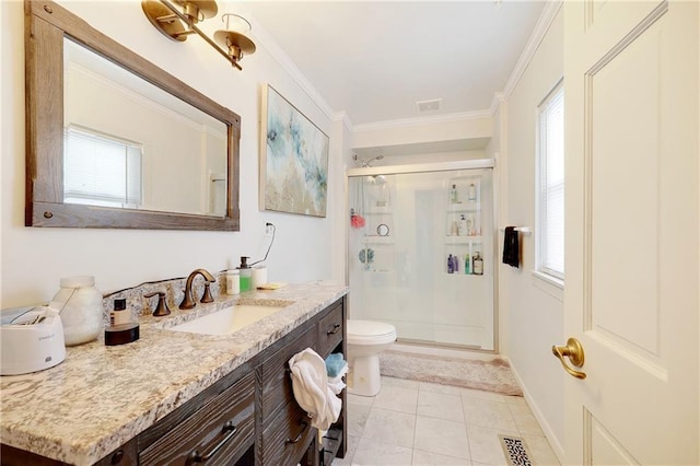 bathroom with a healthy amount of sunlight, crown molding, and a shower stall