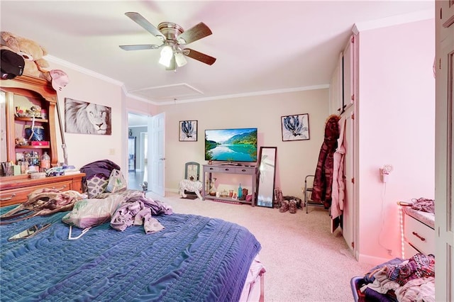 bedroom with attic access, baseboards, light colored carpet, ceiling fan, and crown molding