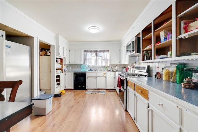 kitchen with stainless steel appliances, white cabinets, ornamental molding, decorative backsplash, and light wood finished floors