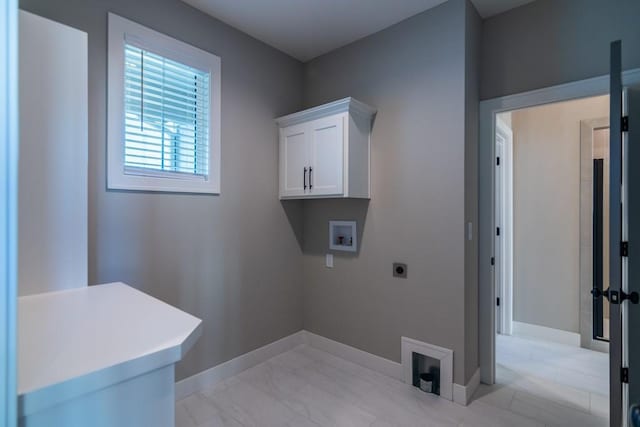 laundry area with marble finish floor, hookup for a washing machine, cabinet space, hookup for an electric dryer, and baseboards