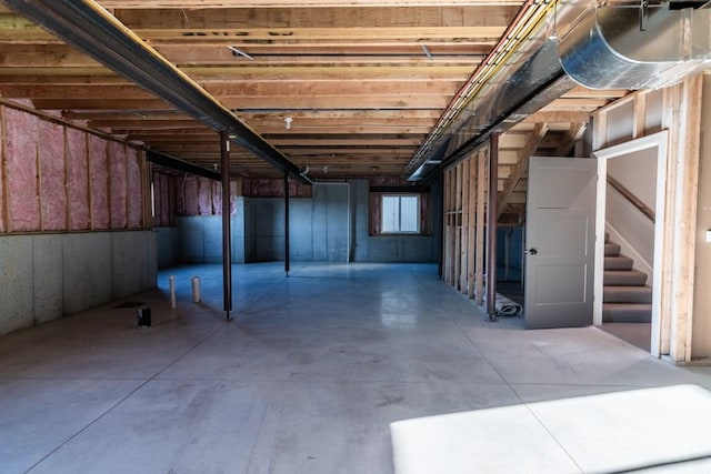 basement featuring stairs