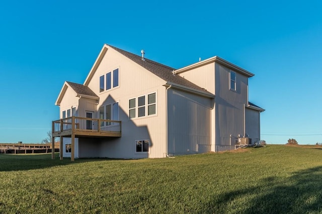 view of side of home with a yard