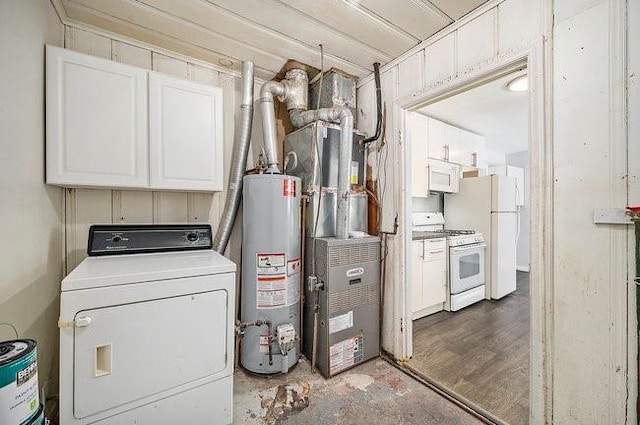 laundry area featuring washer / dryer, water heater, and cabinet space