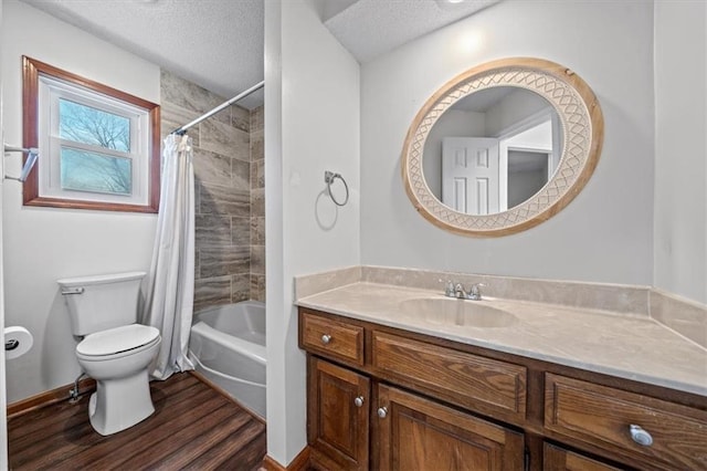 full bath featuring a textured ceiling, toilet, wood finished floors, vanity, and shower / bathtub combination with curtain