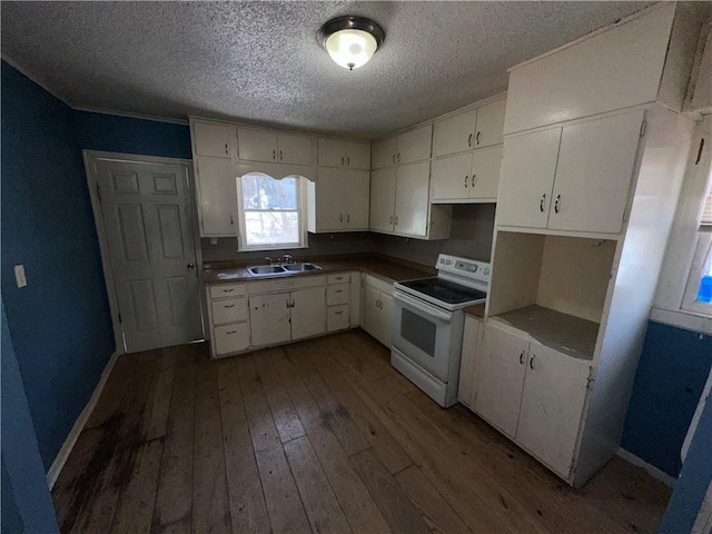 kitchen featuring white cabinetry, a sink, electric range, and wood finished floors