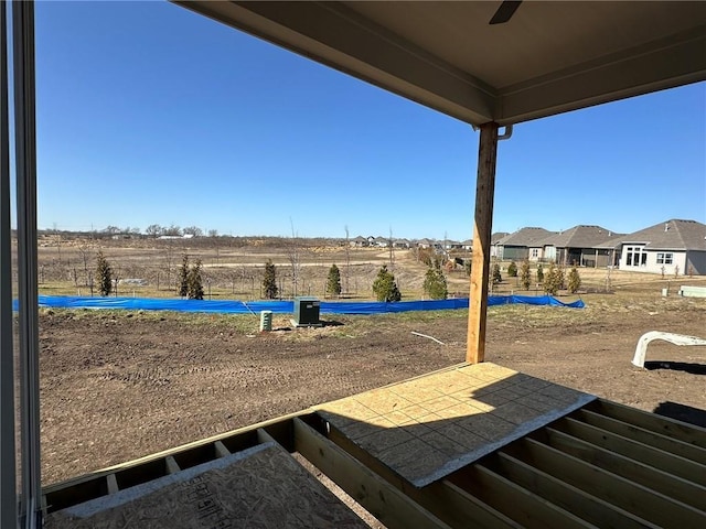 view of yard featuring ceiling fan