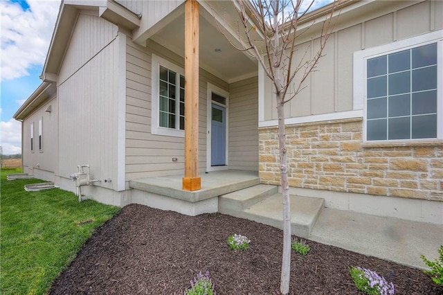 17372 S Kaw St, Olathe, KS 66062 - entrance to property with stone siding and a lawn