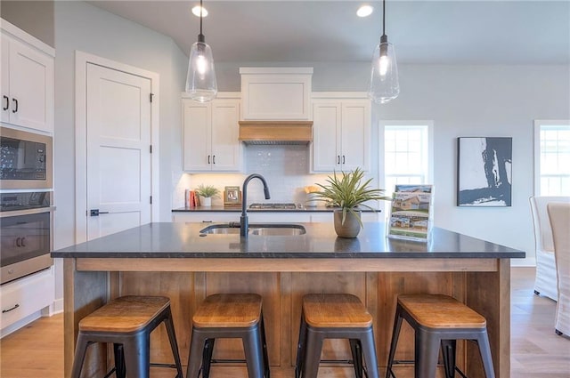 17372 S Kaw St, Olathe, KS 66062 - kitchen with a sink, stainless steel appliances, plenty of natural light, white cabinetry, and recessed lighting