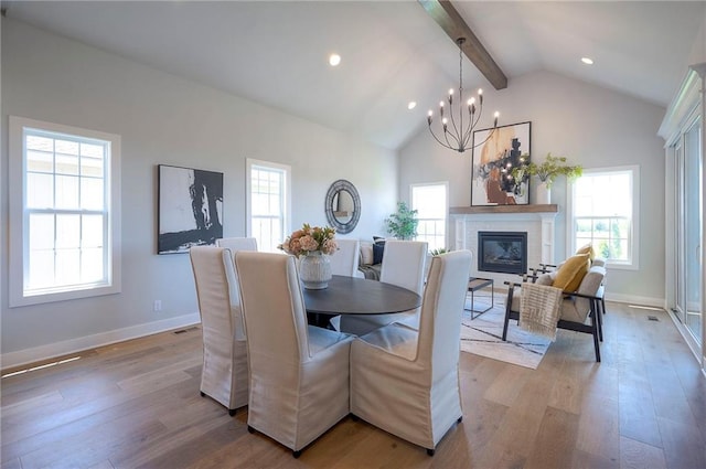 17372 S Kaw St, Olathe, KS 66062 - dining room featuring beamed ceiling, wood finished floors, healthy amount of natural light, recessed lighting, and high vaulted ceiling