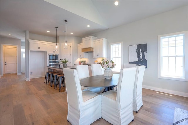 17372 S Kaw St, Olathe, KS 66062 - dining space featuring light wood finished floors, recessed lighting, and baseboards