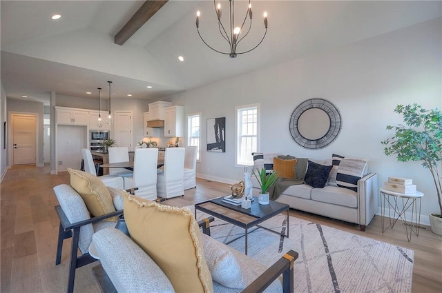 17372 S Kaw St, Olathe, KS 66062 - living room with a chandelier, baseboards, recessed lighting, and light wood-style flooring