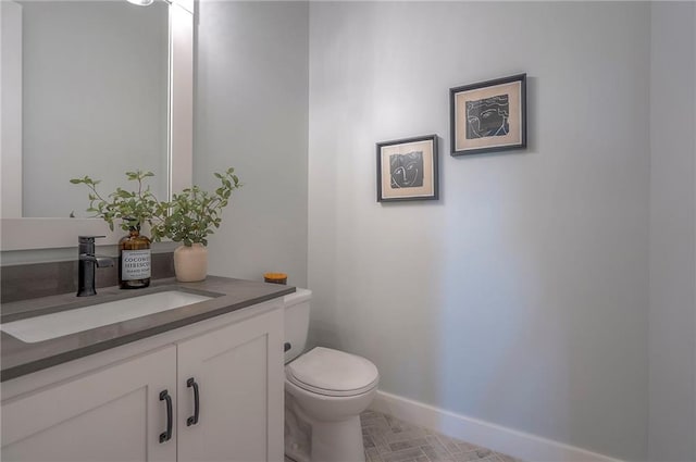 17372 S Kaw St, Olathe, KS 66062 - half bathroom featuring vanity, toilet, and baseboards